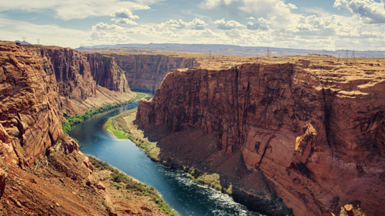 A narrow river winding its way through the Grand Canyon.